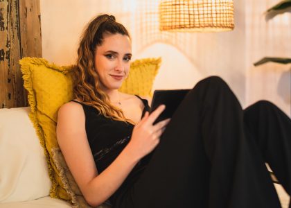 Woman reading lying back Woman reading lying back